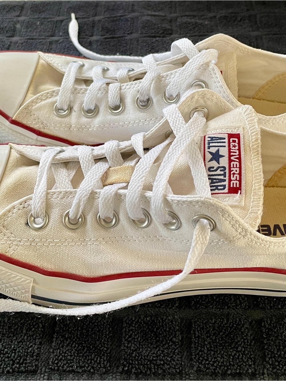 Converse Classic Chuck Taylor White Low Top Canvas Sneakers with Red Trim